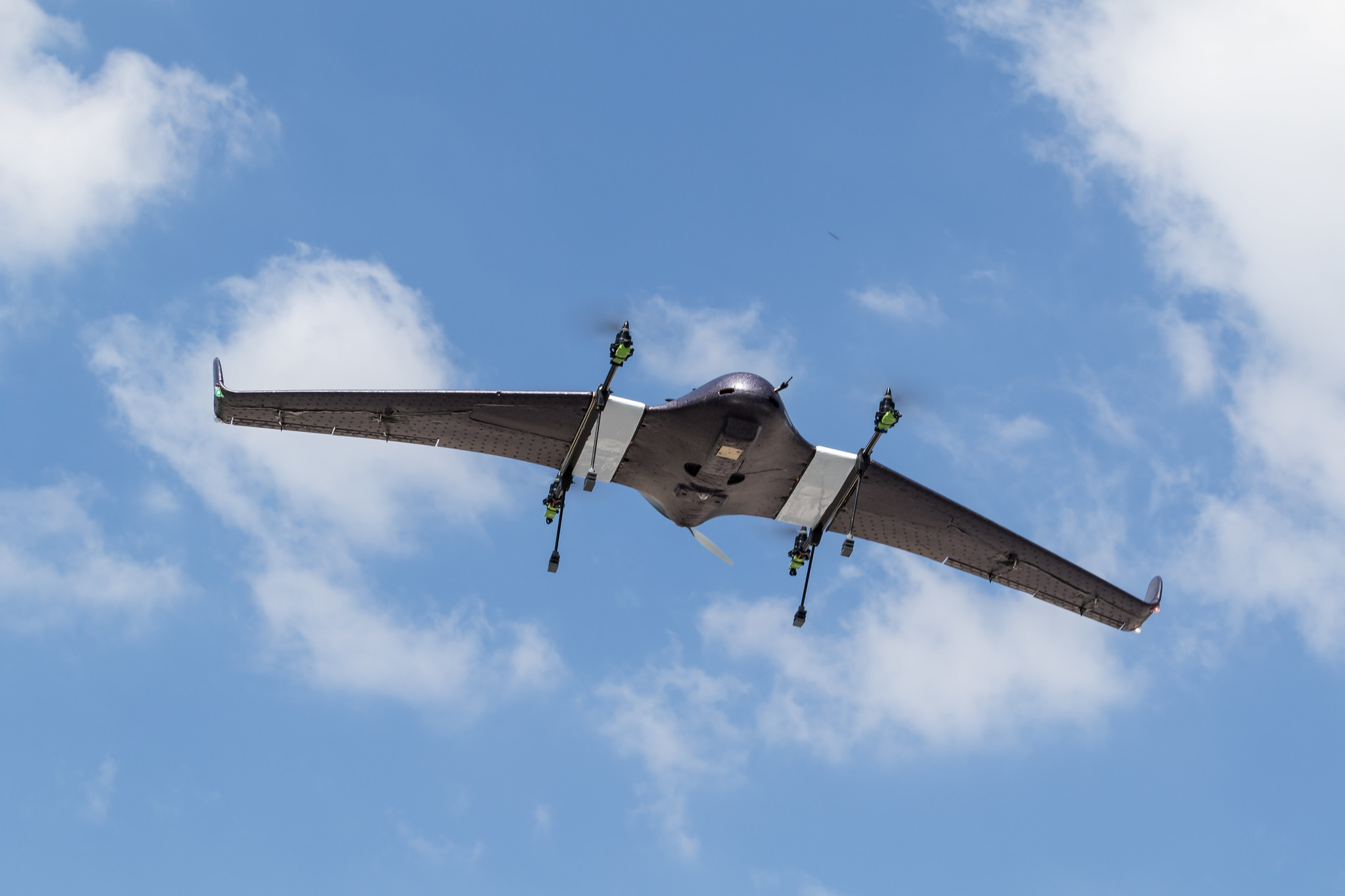 Drone against cloudy blue sky